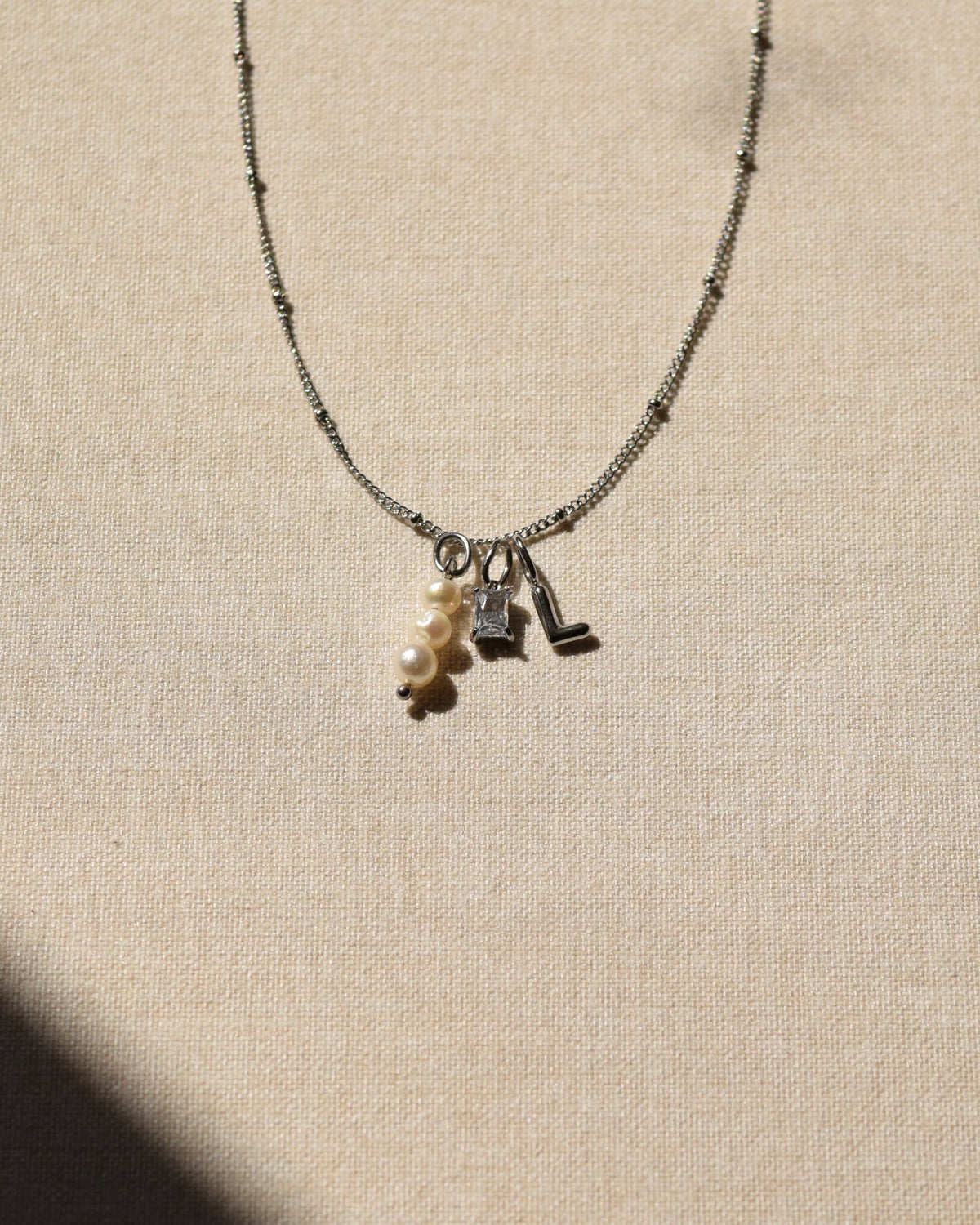 INITIAL Charm